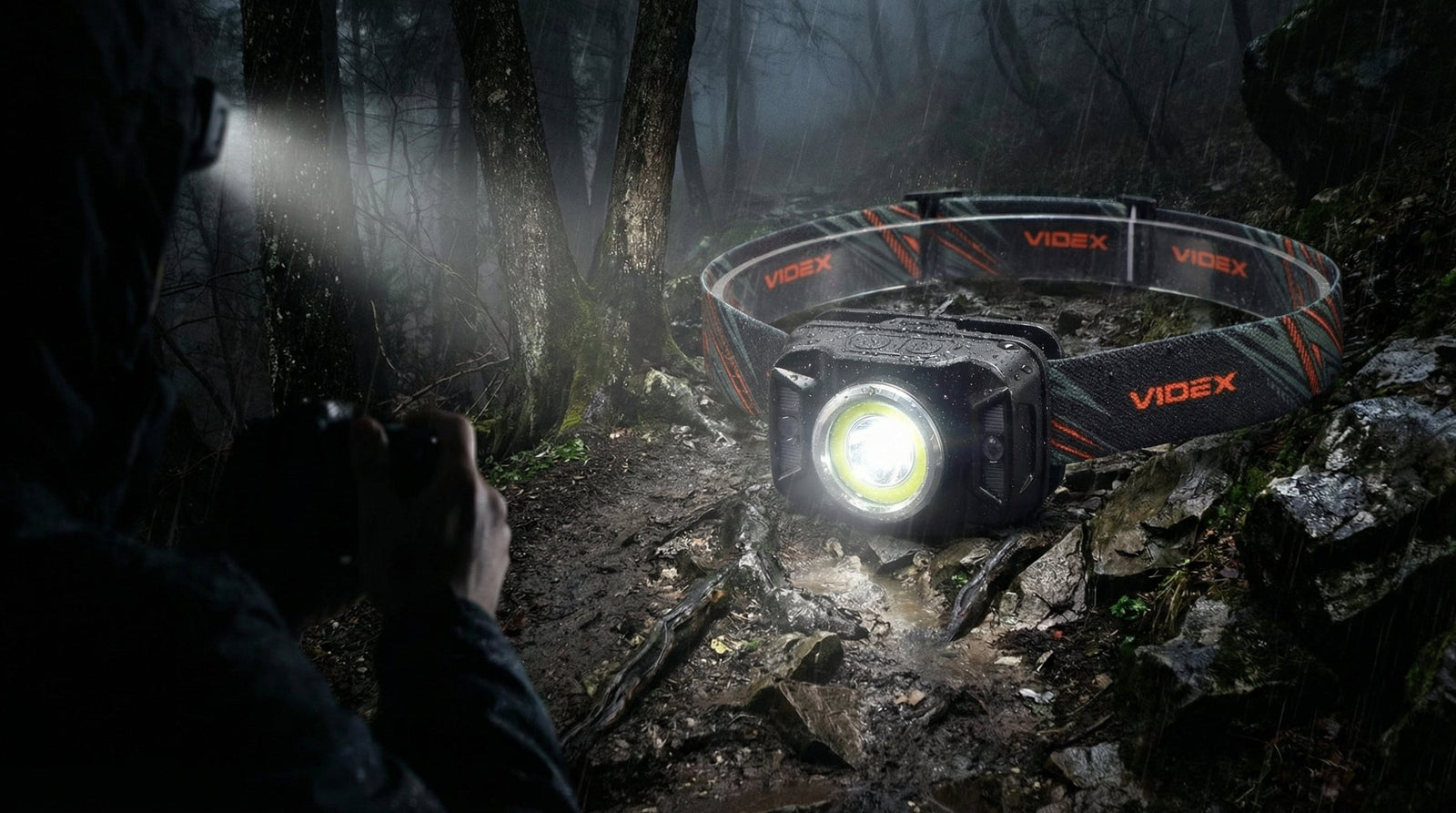 Generic headlamp shown on dark forest trail